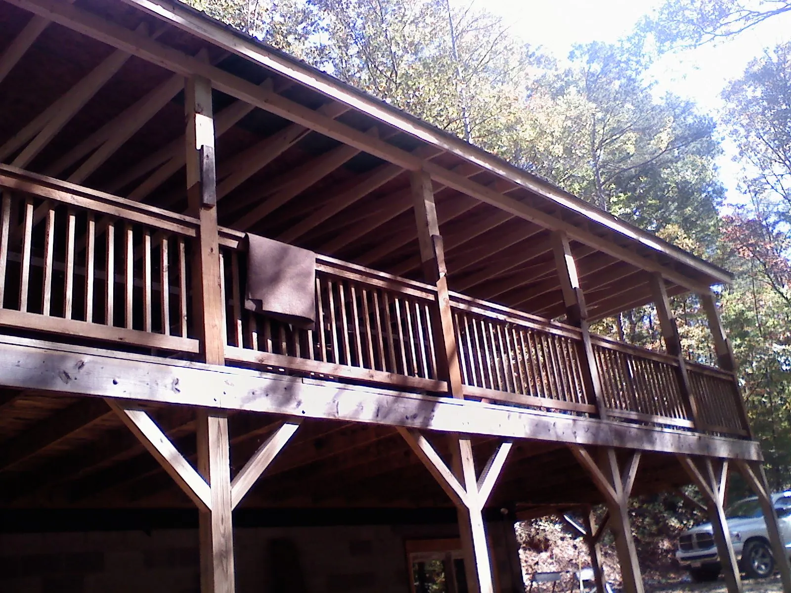 Timber framing under a new elevated porch and deck — Roof Leak Repair in Needham by Roofing Brothers